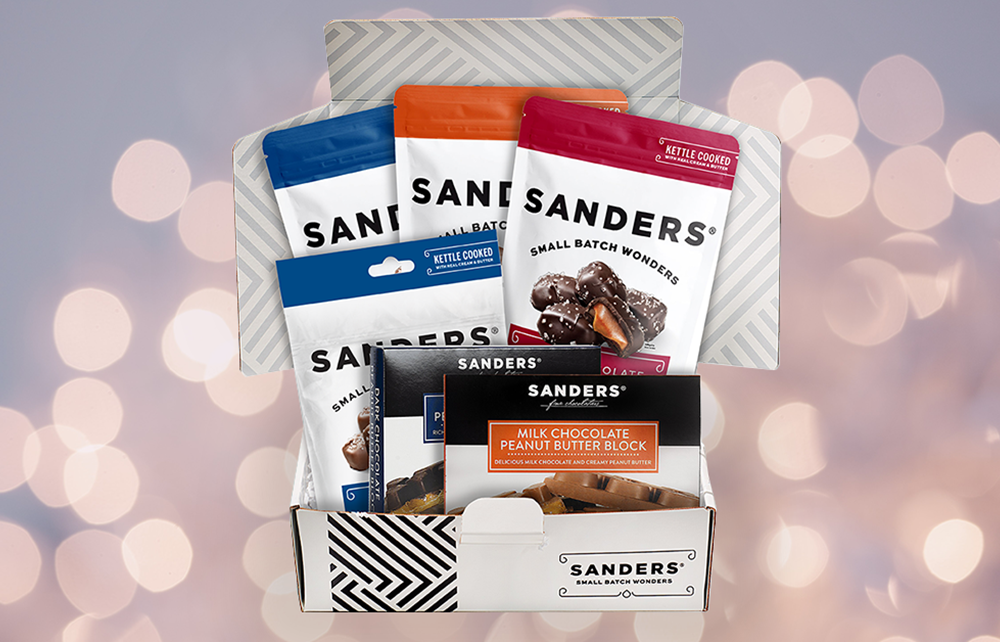 Collection of Sanders chocolate bars in a box with a blurred light background