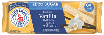 Alt text: "Packaging of Voortman Bakeries Vanilla Wafers. Features 'Zero Sugar' label, wafers and a vanilla flower image, emphasizing natural flavor."