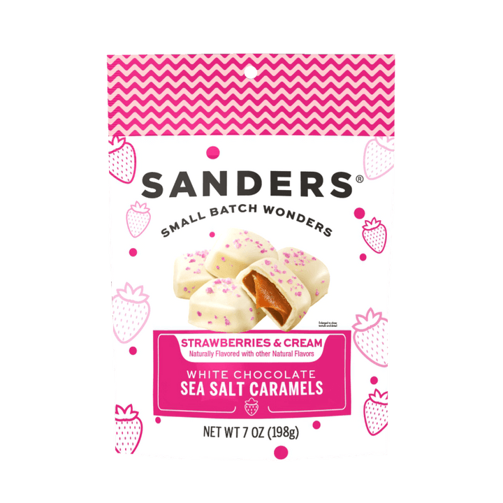 White bag of Sanders Small Batch Wonders with a pink and white chevron pattern. Labeled "Strawberries & Cream White Chocolate Sea Salt Caramels."