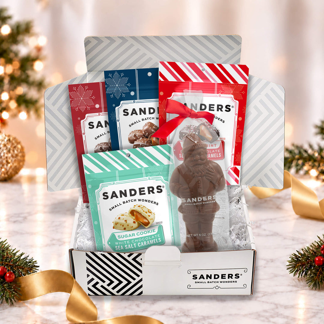 Sanders Classic Holiday 5-item gift box with peppermint, sugar cookie, milk and dark chocolate sea salt caramels and chocolate Santa.