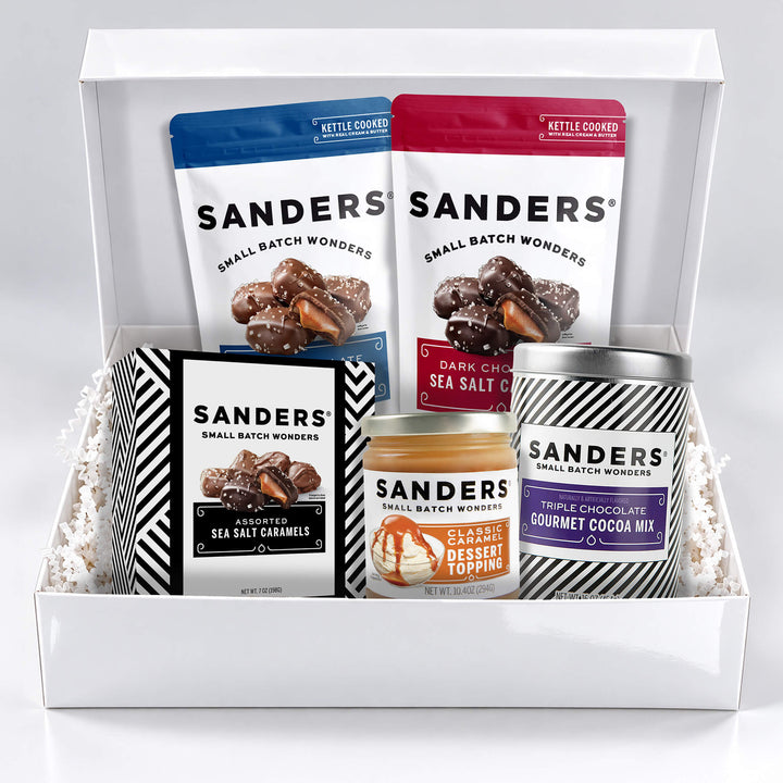 Sanders Indulgence 5-item gift box with milk and dark chocolate sea salt caramels, assorted caramels, cocoa mix, and caramel dessert topping.