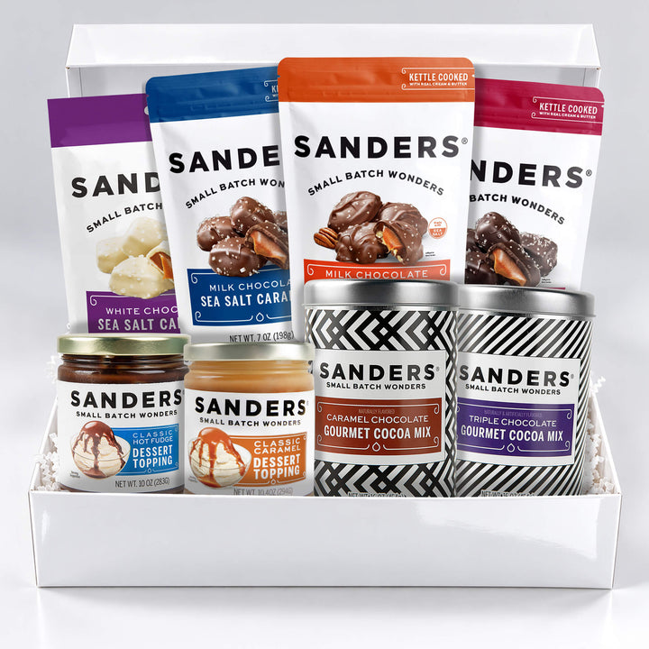 Sanders Signature Gift Box featuring seven gourmet treats, including milk, dark and white chocolate sea salt caramels, pecan clusters, dessert toppings and cocoa mixes.