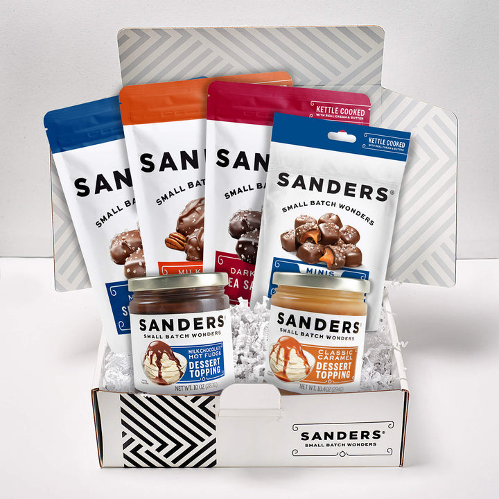 Box of Sanders dessert toppings with various packages on a white background