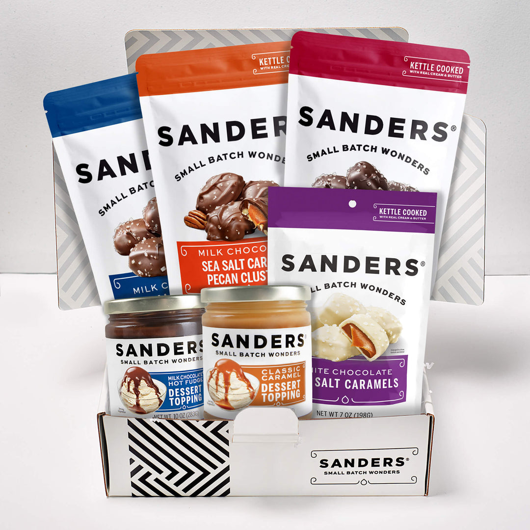 Sanders Appreciation 6-item gift box with assorted chocolate sea salt caramels, pecan clusters, hot fudge, and caramel dessert toppings.