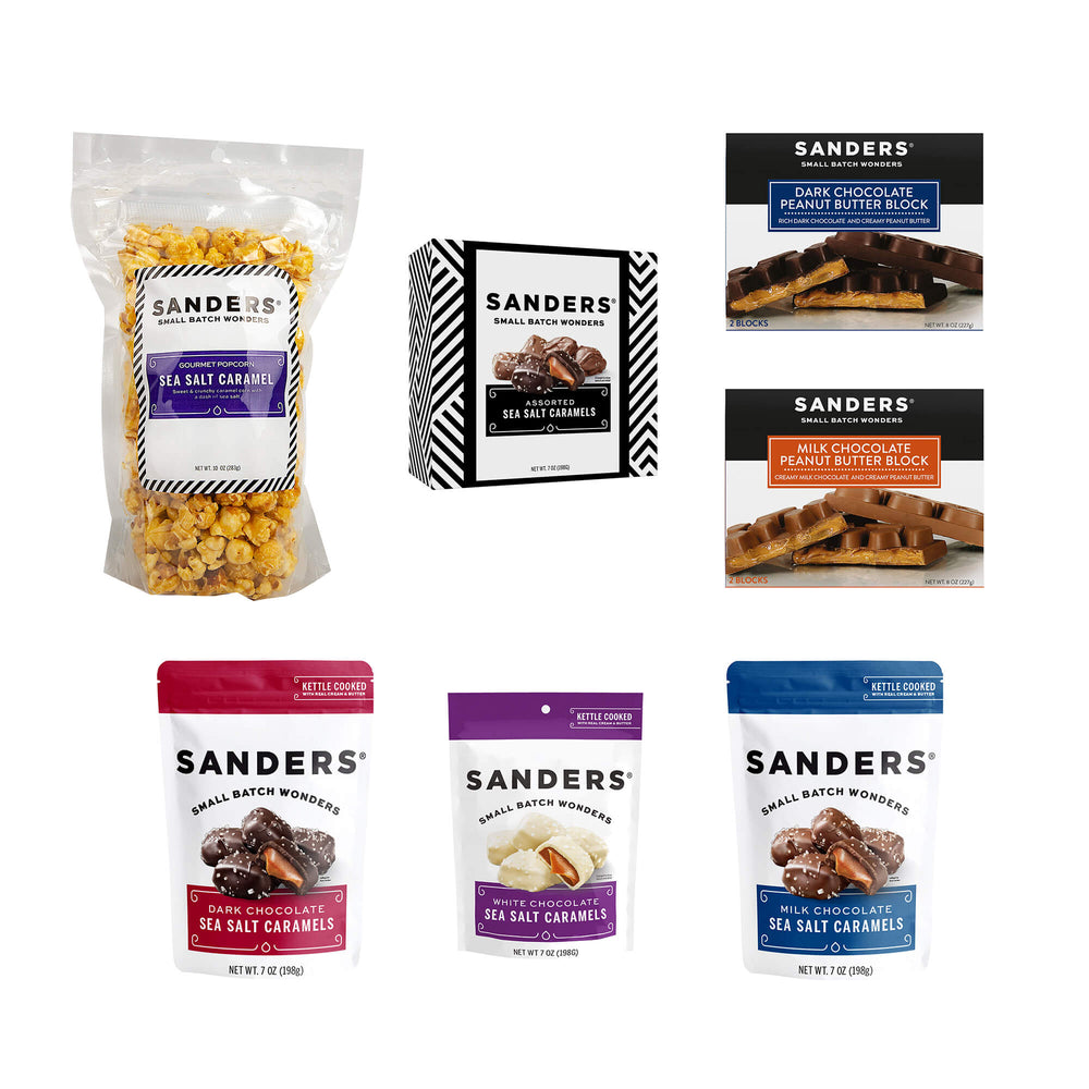 Assorted Sanders products on white background: sea salt caramel popcorn, assorted caramels, peanut butter blocks, and chocolate sea salt caramel bags.