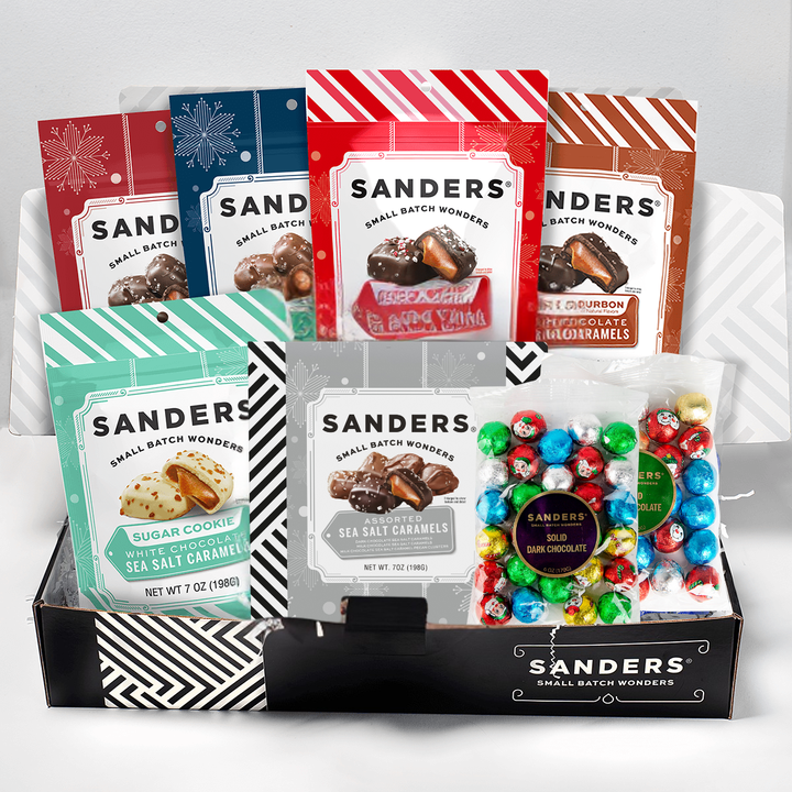 Assorted Sanders chocolate and candy packages on a white background