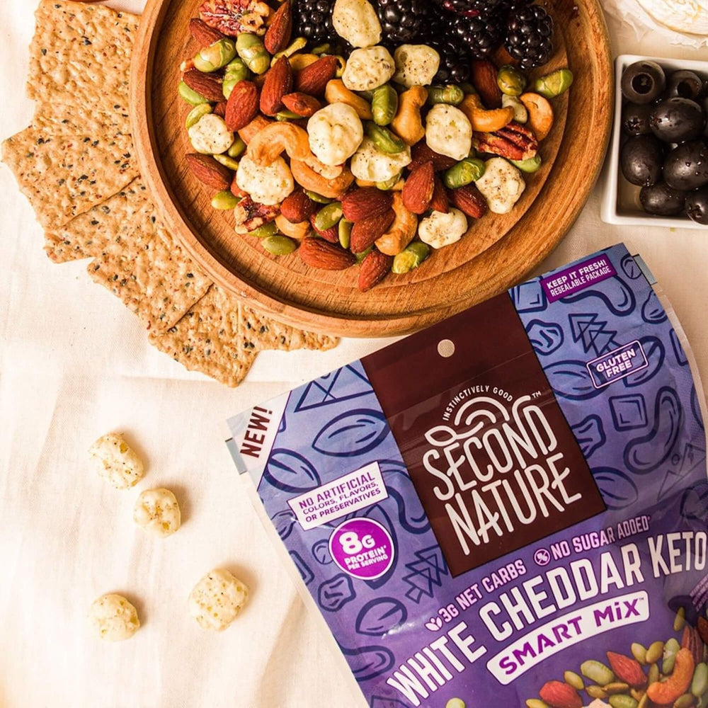 White Cheddar Keto Smart Mix - 10 oz. with nutes and berries in a wooden bowl and olive at the side